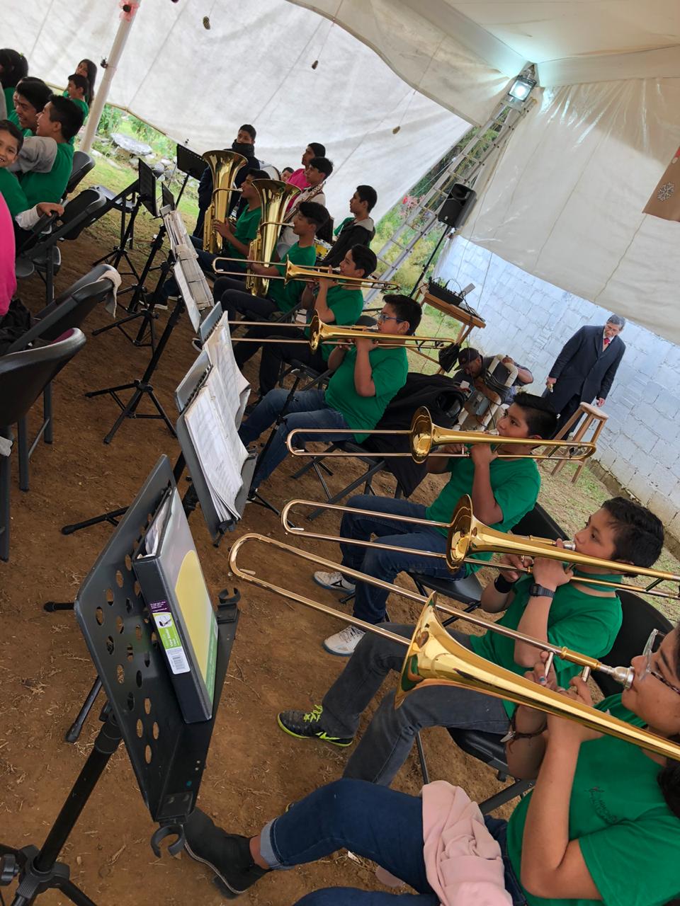 The children from Amanalco playing the trombones.